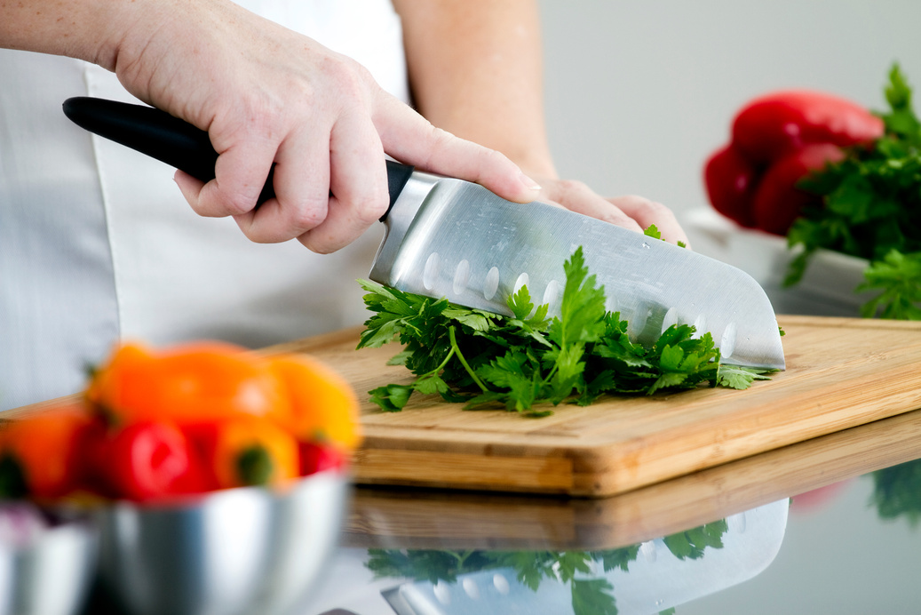 Woman chopping vegetable